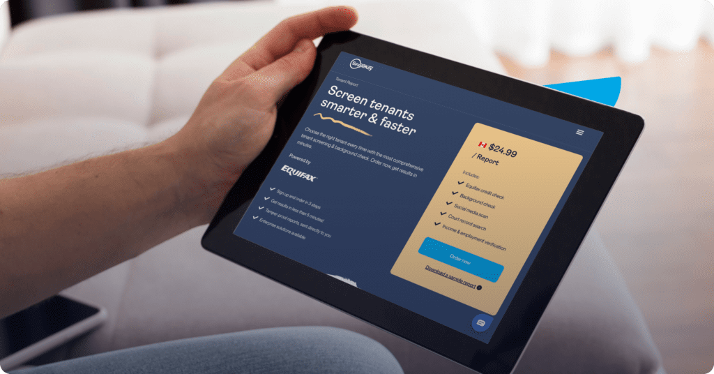 A person holding a tablet with SingleKey's Tenant Report information on the screen.