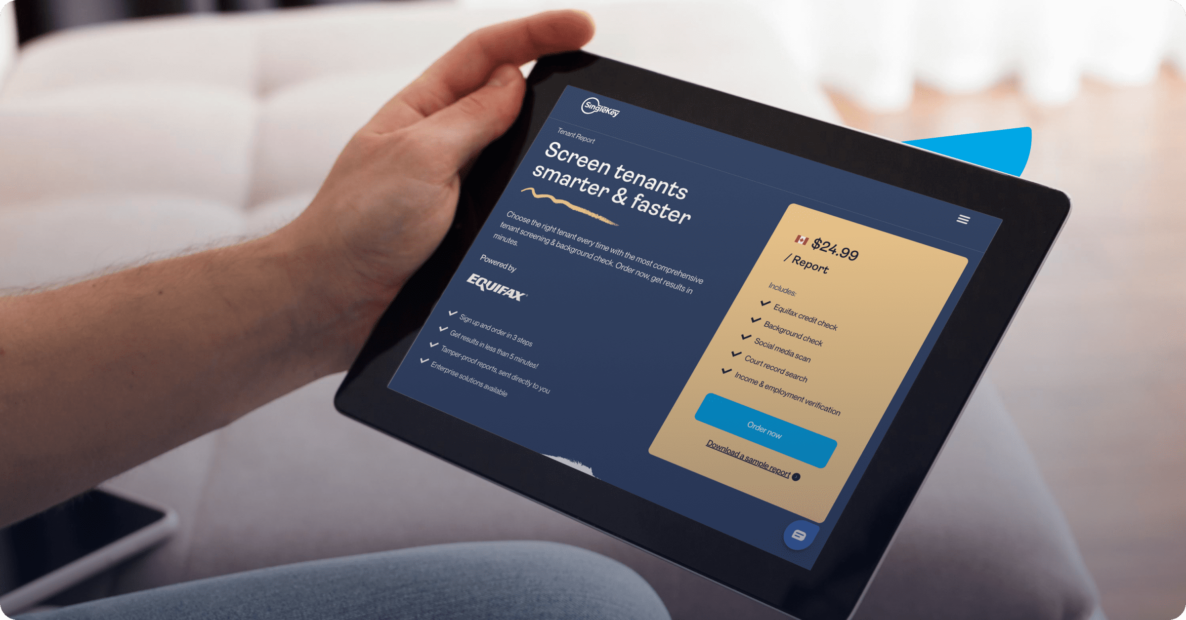 A person holding a tablet with SingleKey's Tenant Report information on the screen.