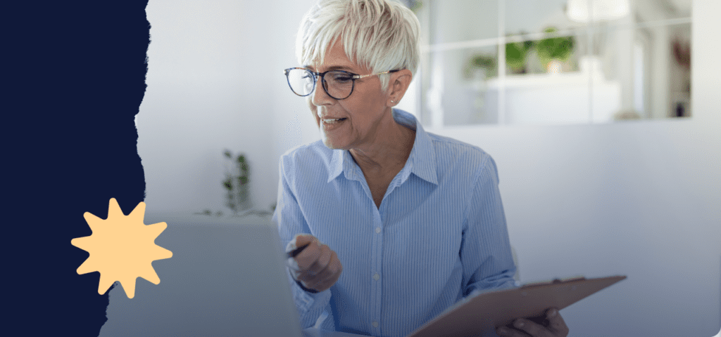 A person holding a clip board and pointing at a laptop screen while working on California rental agreements.